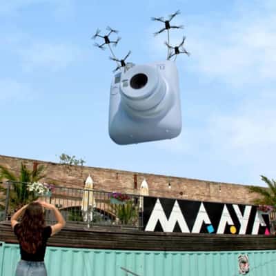 Camera Delivery by Drones in a fake-out-of-home ad of Instax