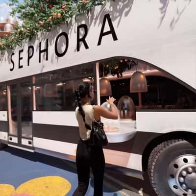 Woman Takes Beauty Collection from Bus in a fake-out-of-home ad of OLEHENRIKSEN