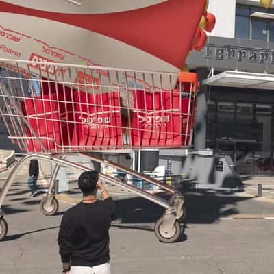 Push Carts  Rolling Down with Voucher in a fake-out-of-home ad of Shufersal