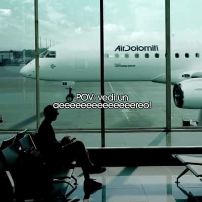 Long Airplane Running at Tarmac in a fake-out-of-home ad of Air Dolomiti