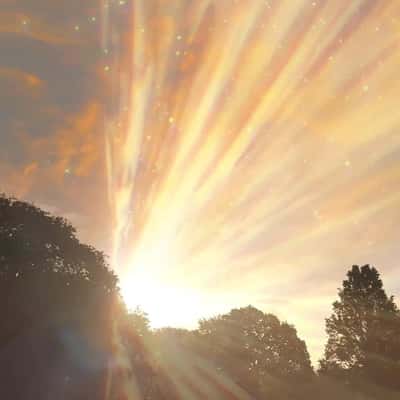 Golden Light Emanates from the Sun in a fake-out-of-home ad of Astrid & Miyu