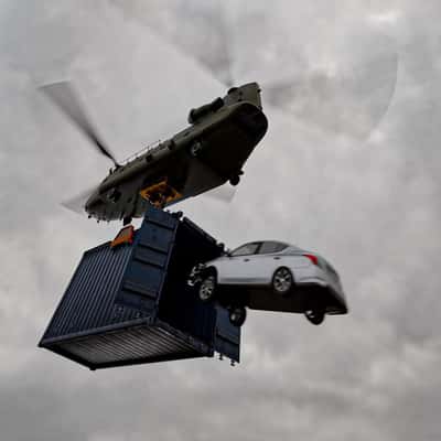 Car Jumps onto Boxship from Helicopter in a fake-out-of-home ad of Automax