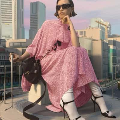 Giant Model Poses at Roundabout in a fake-out-of-home ad of Balenciaga