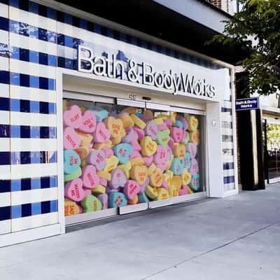 Heart Candies Overflow in a fake-out-of-home ad of Bath & Body Works
