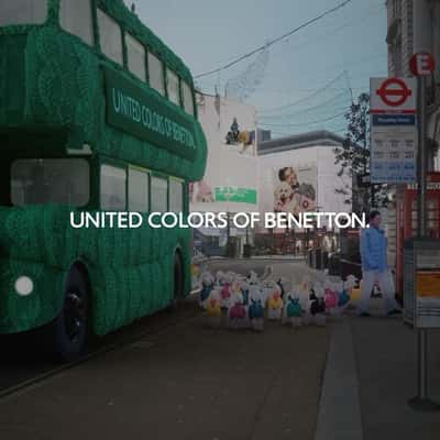 Dogs Exit from Double-decker Bus in a fake-out-of-home ad of Benetton