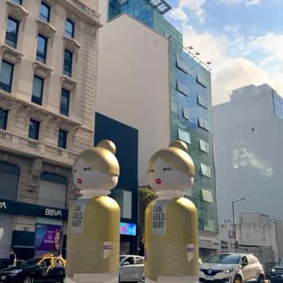 Perfume Bottles Strolling on Street in a fake-out-of-home ad of Benetton Perfume