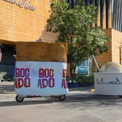 Food Carts Roll Down the Street in a fake-out-of-home ad of Bocado