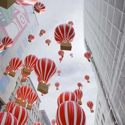 Shopping Bag on Hot Air Balloons in a fake-out-of-home ad of Boggi Milano