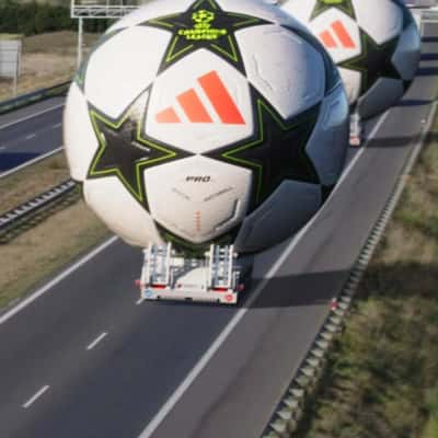 Trucks Transporting Footballs in a fake out of home ad of CANAL+