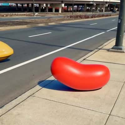 Candies Burst Out of Billboard in a fake-out-of-home ad of Candy Crush