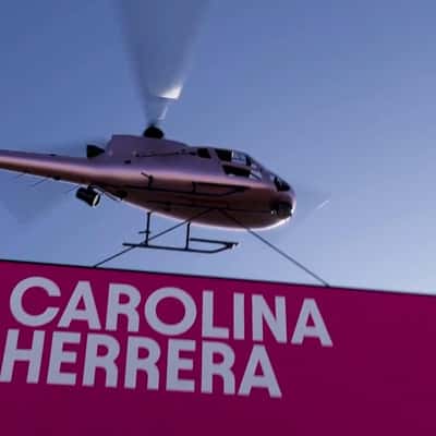 Helicopter Carrying Event Banner in a fake-out-of-home ad of Carolina Herrera
