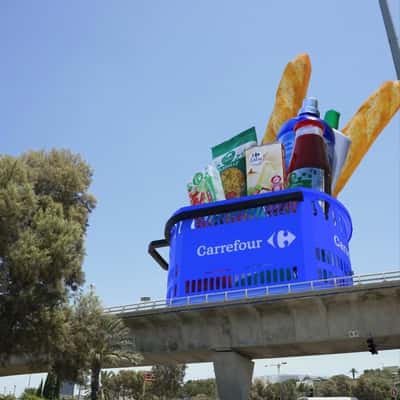Shopping Basket Rolls on Highway in a fake-out-of home ad of Carrefour
