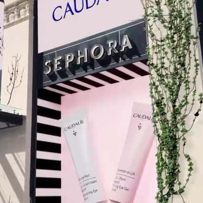 Grapes Spill Out of Window Display in a fake-out-of-home ad of Caudalie
