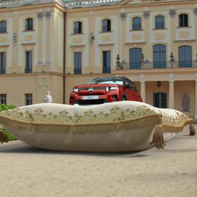 Car Riding on Pillow in a fake-out-of-home ad of Citroën