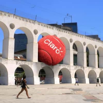 Red Tennis Ball Trapped at Arcos da Lapa in a fake-out-of-home ad of Claro