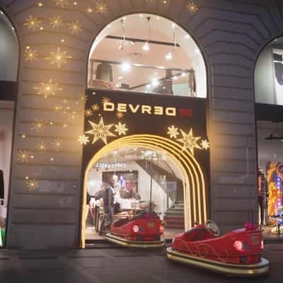 Sled Cars Loaded with Gifts in a fake-out-of-home ad of Devred