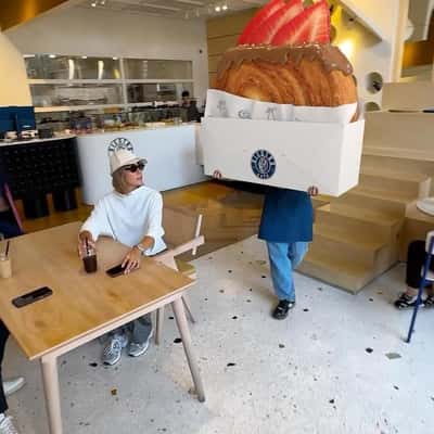 Massive Pastry Placed on Table in a fake-out-of-home ad of Diestro Cafe