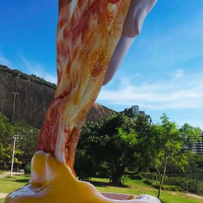 Hand Dips Pizza on Sauce  in a fake-out-of-home ad of Domino's Pizza
