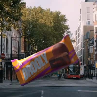 Chocolate Bar Lands on the Street in a fake-out-of-home ad of Drooly