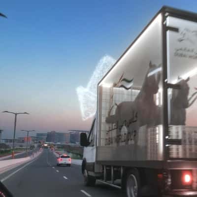 Drone Forms Direction Arrow in a fake-out-of-home ad of Dubai Racing Club