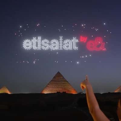 Drone Light Show at Pyramids of Giza in a fake-out-of-home ad of e& Egypt