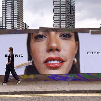Woman Peels Adhesive Tape in a fake-out-of-home ad of Estrid