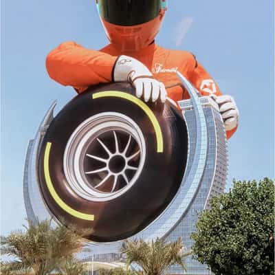 Racer Spins Wheel at Hotel in a fake-out-of-home ad of Fairmont Hotels & Resorts