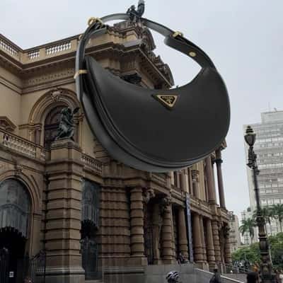 Handbag Hangs at Theatro Municipal in a fake-out-of-home ad of Farfetch