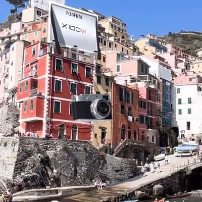 Camera Hangs from Building in a fake-out-of-home ad of Fujifilm