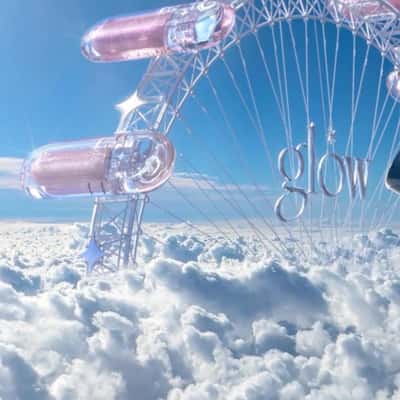 Eye Shadow Ferris Wheel in the Clouds in a fake-out-of-home ad of Glow