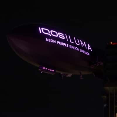 Tobacco Devices Emerges from Window Display in a fake-out-of-home ad of IQOS