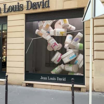 Products Overflow in the Window Display in a fake-out-of-home ad of JLD