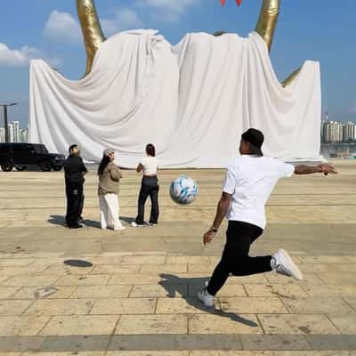 Golden Hand Gesture Sculpture in a fake-out-of-home ad of Jesse Lingard