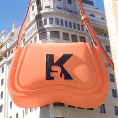 Orange Bag Hangs on the Building in a fake-out-of-home ad of Karl Lagerfeld