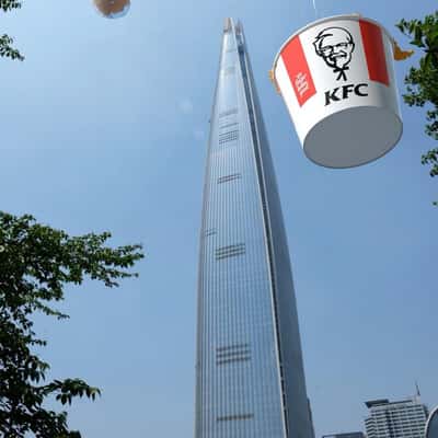 Chicken Bucket Lands with Balloons in a fake-out-of-home ad of KFC