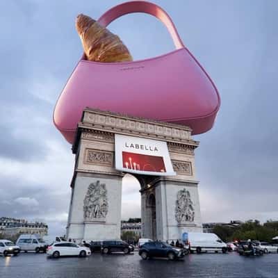 Croissant Peeking from Handbag in a fake-out-of-home ad of Labella
