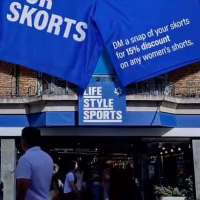 Shorts Suspended at Storefront in a fake-out-of-home-ad of Lifestyle Sports