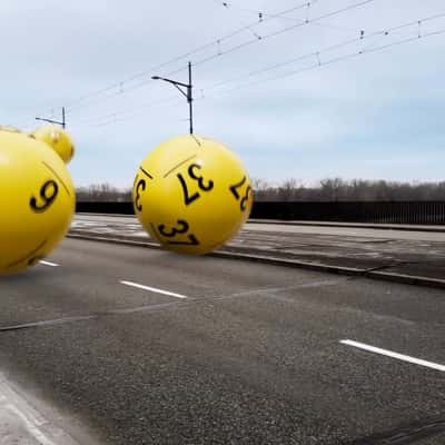 Numbered Balls Bounce on Street in a fake-out-of-home ad of Lotto