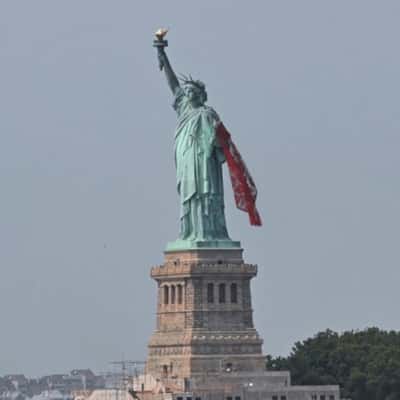Scarf Draped on Liberty’s Arm in a fake-out-of-home ad of Magda Butrym
