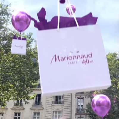 Purple Balloons Lift Shopping Bags in a fake-out-of-home ad of Marionnaud