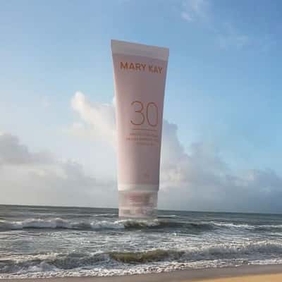 Sunscreen Inflates Above Ocean Waves in a fake-out-of-home ad of Mary Kay