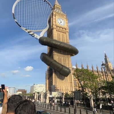 Tennis Racket Wraps Around Big Ben in a fake-out-of-home ad of Wimbledon