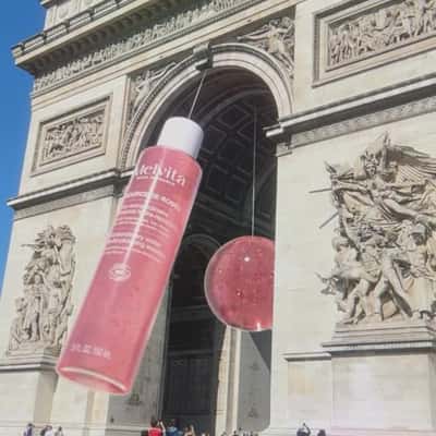 Essence Bottle Swings at Monument in a fake-out-of-home ad of Melvita