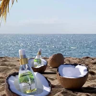 Coconut Reveals Oil Bottle in a fake-out-of-home ad of OGX Beauty