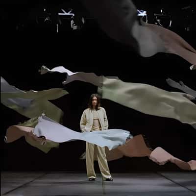 Scarves Elegantly Float at a Lady in a fake-out-of-home ad of DRYKORN