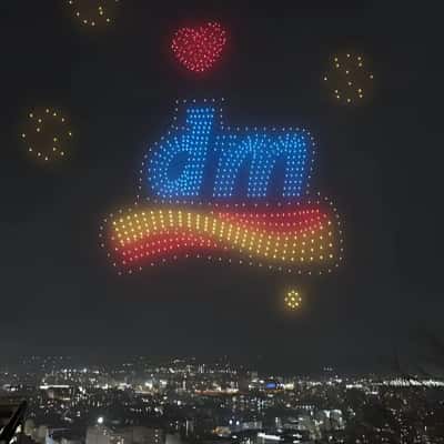 Rooftop Drone Light Show in fake-out-of-home ad of DM