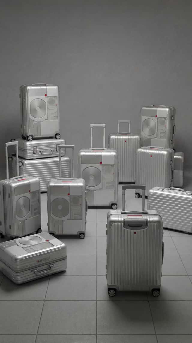 Rimowa x Nothing suitcase campaign key visual on white stage