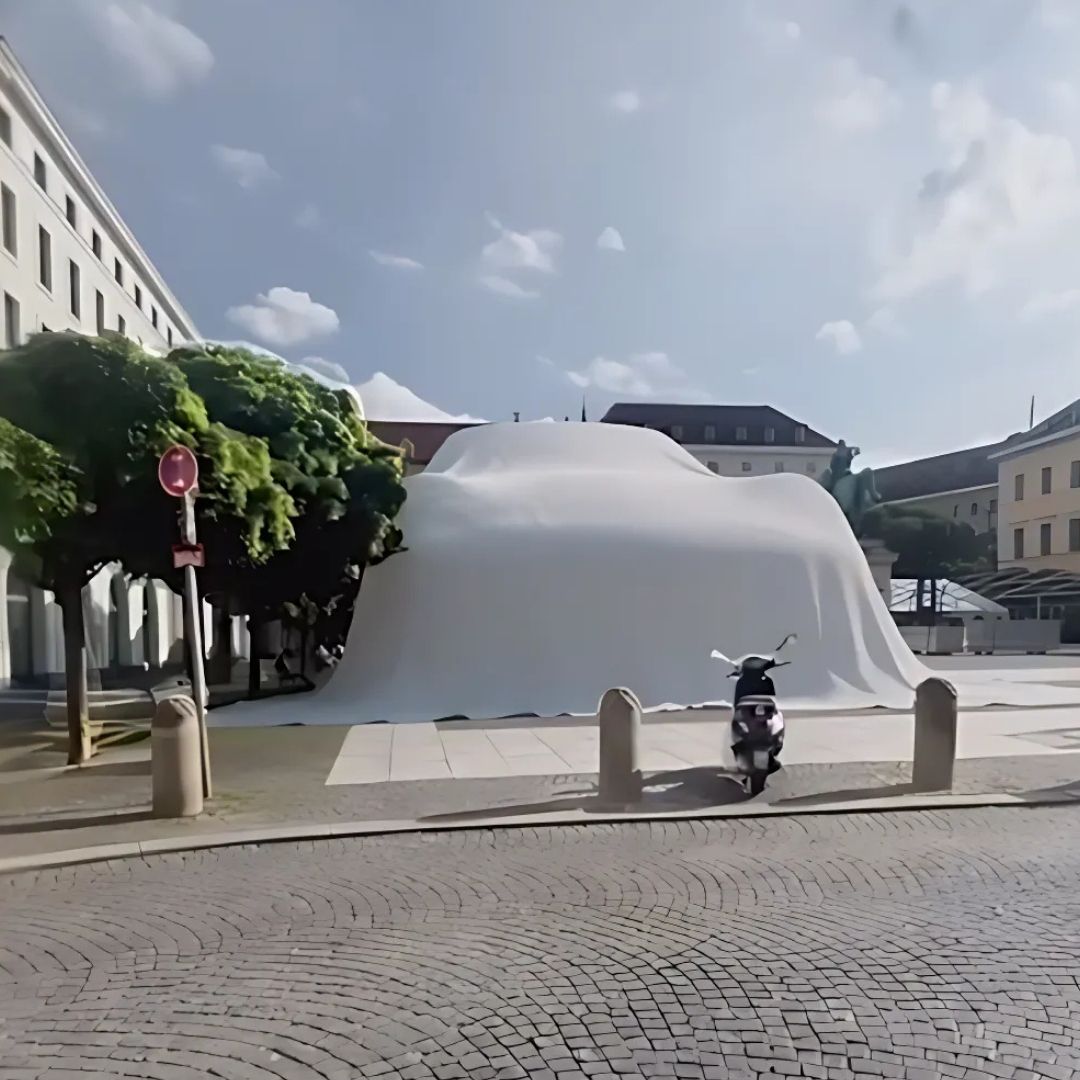 Gigantic Porsche covered at Wittelsbacherplatz in Munich fake-out-of-home ad of Porsche 